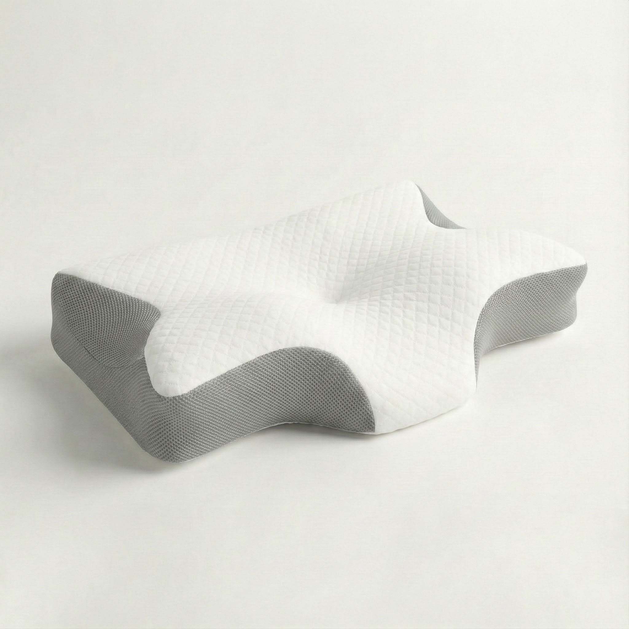 White pillow with textured surface on a light gray background