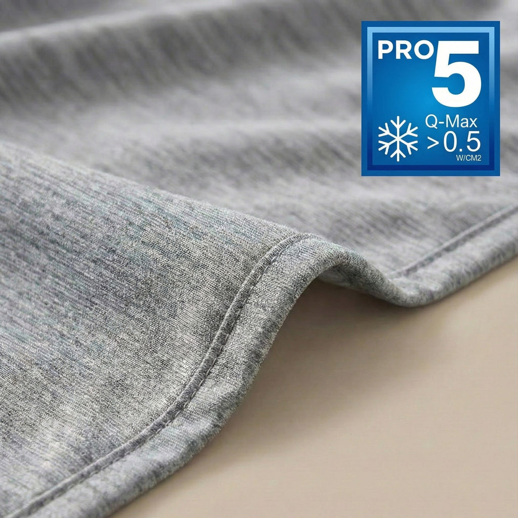 Gray fabric with a Pro 5 Q-Max >0.5 W/m2k label on a beige background