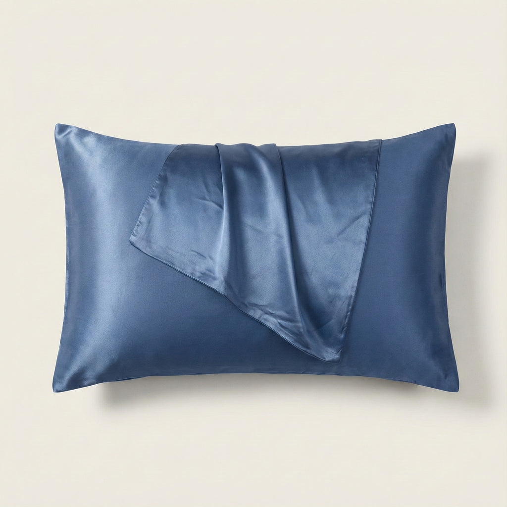Blue satin pillowcase on a beige background