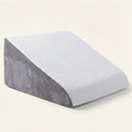 Gray and white wedge pillow on a light beige background